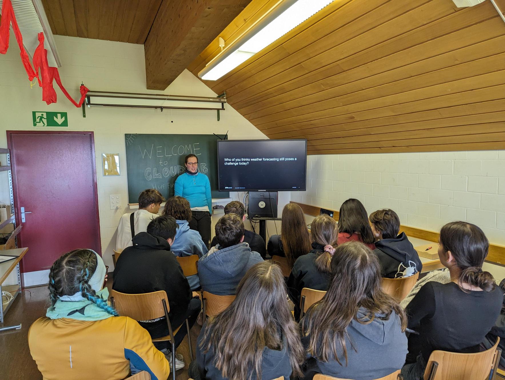 Enlarged view: Presentation by Nadja Omanovic, giving an introduciton to numerical weather prediction.