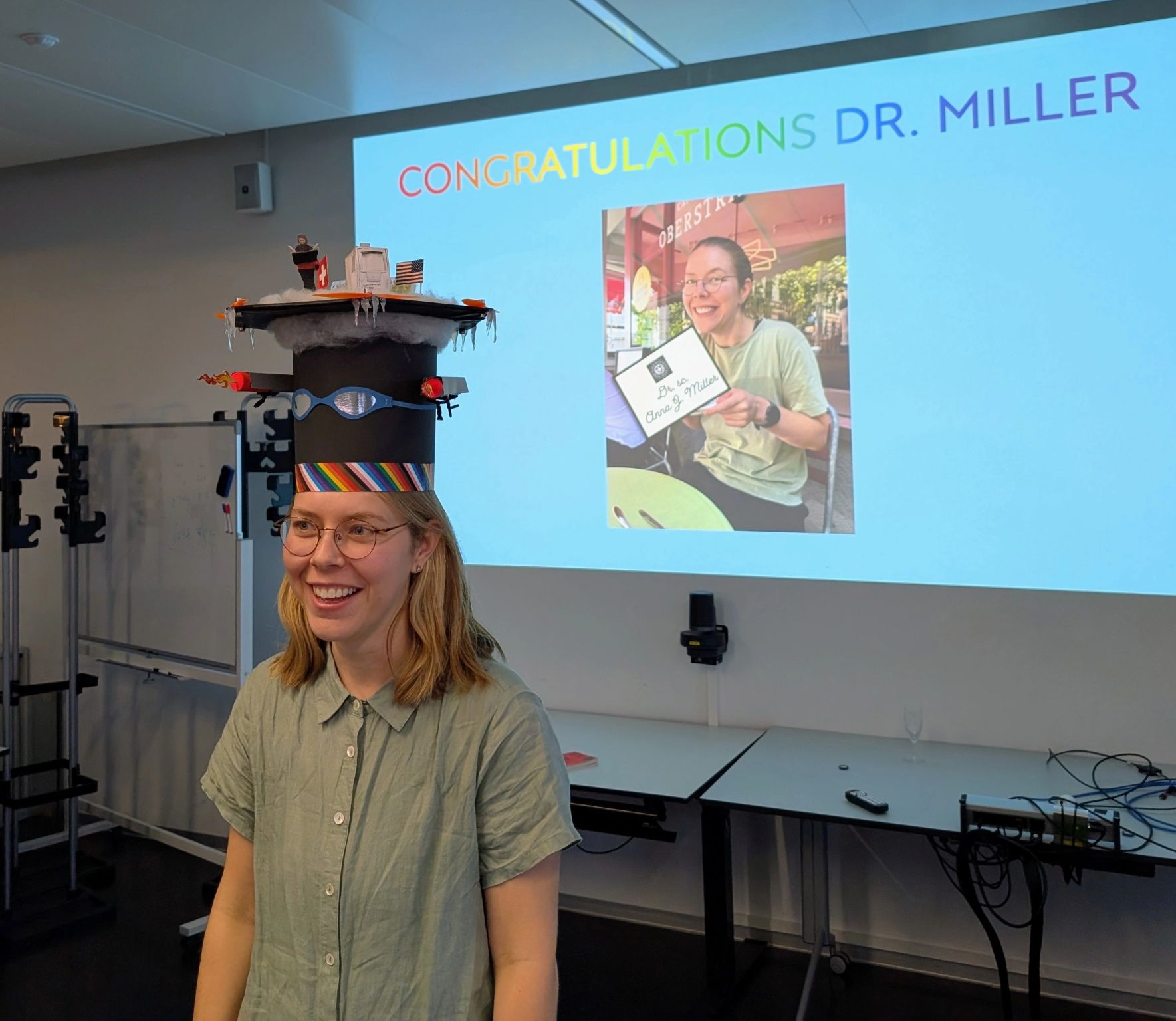 Anna in her doctorate hat at the after-defense.